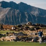 Lofoten guest golfing with backdrop